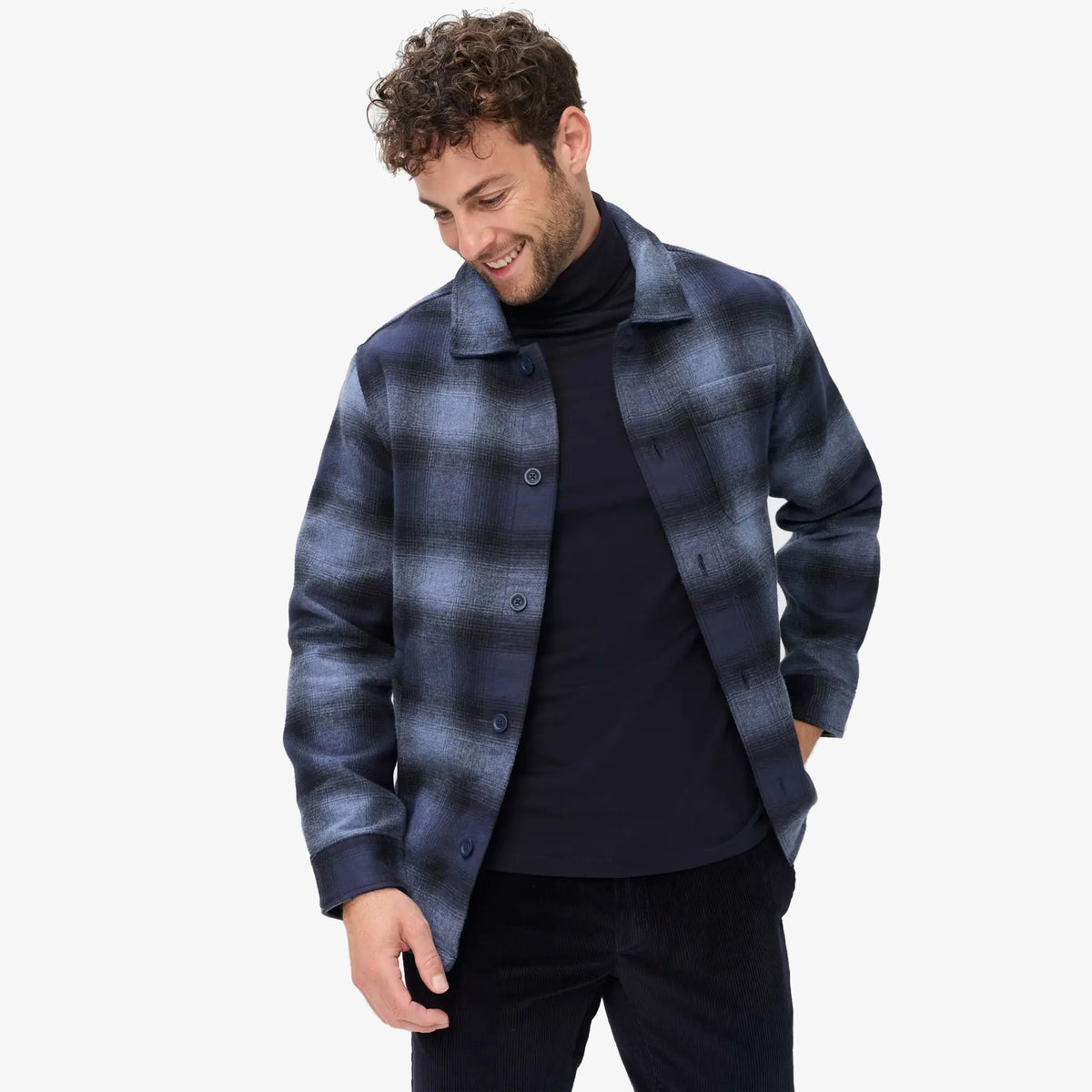 A man wearing a Brax blue checked flannel overshirt/shacket