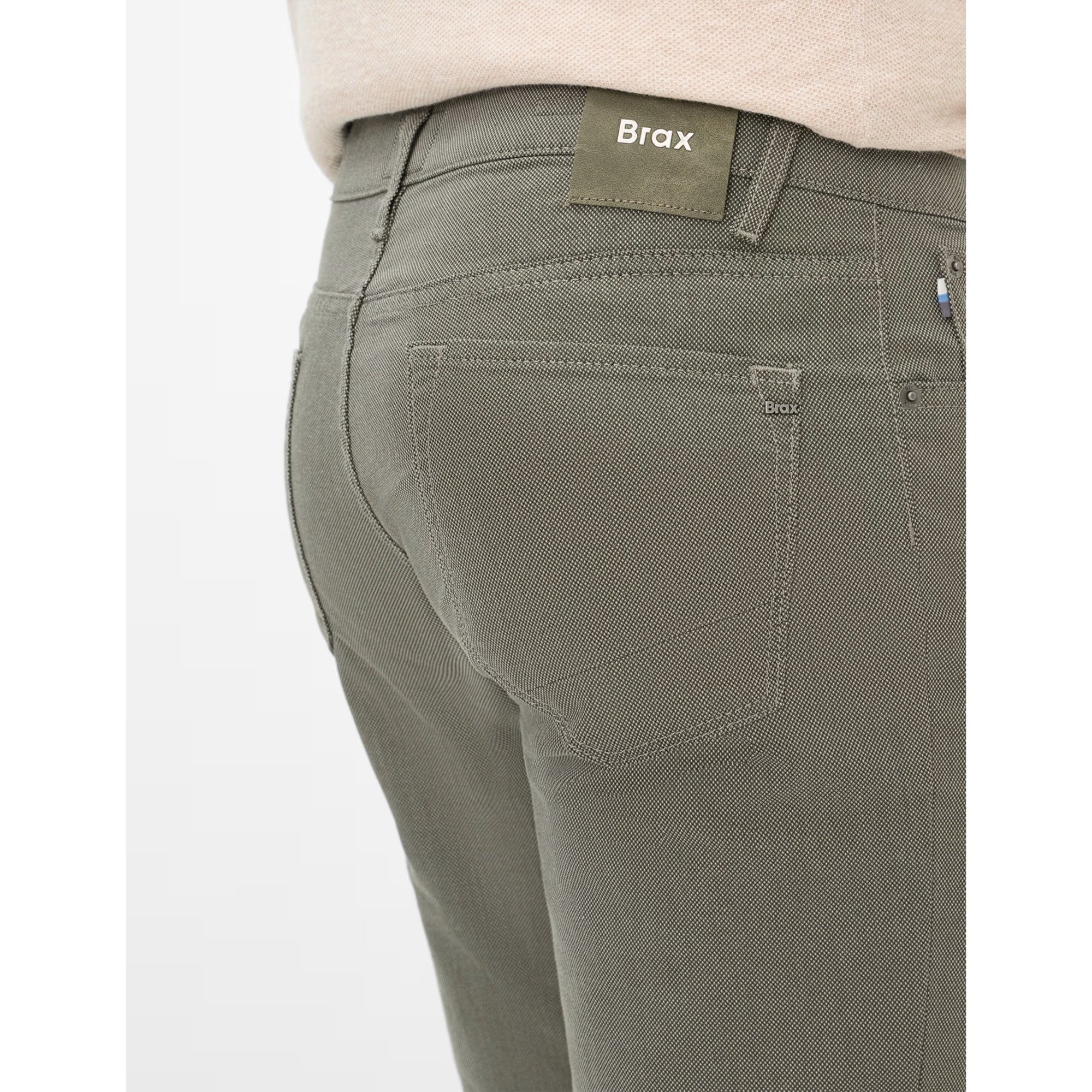 Green pants with Brax label on a white background