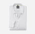 Folded white dress shirt with collar detail on a light gray background
