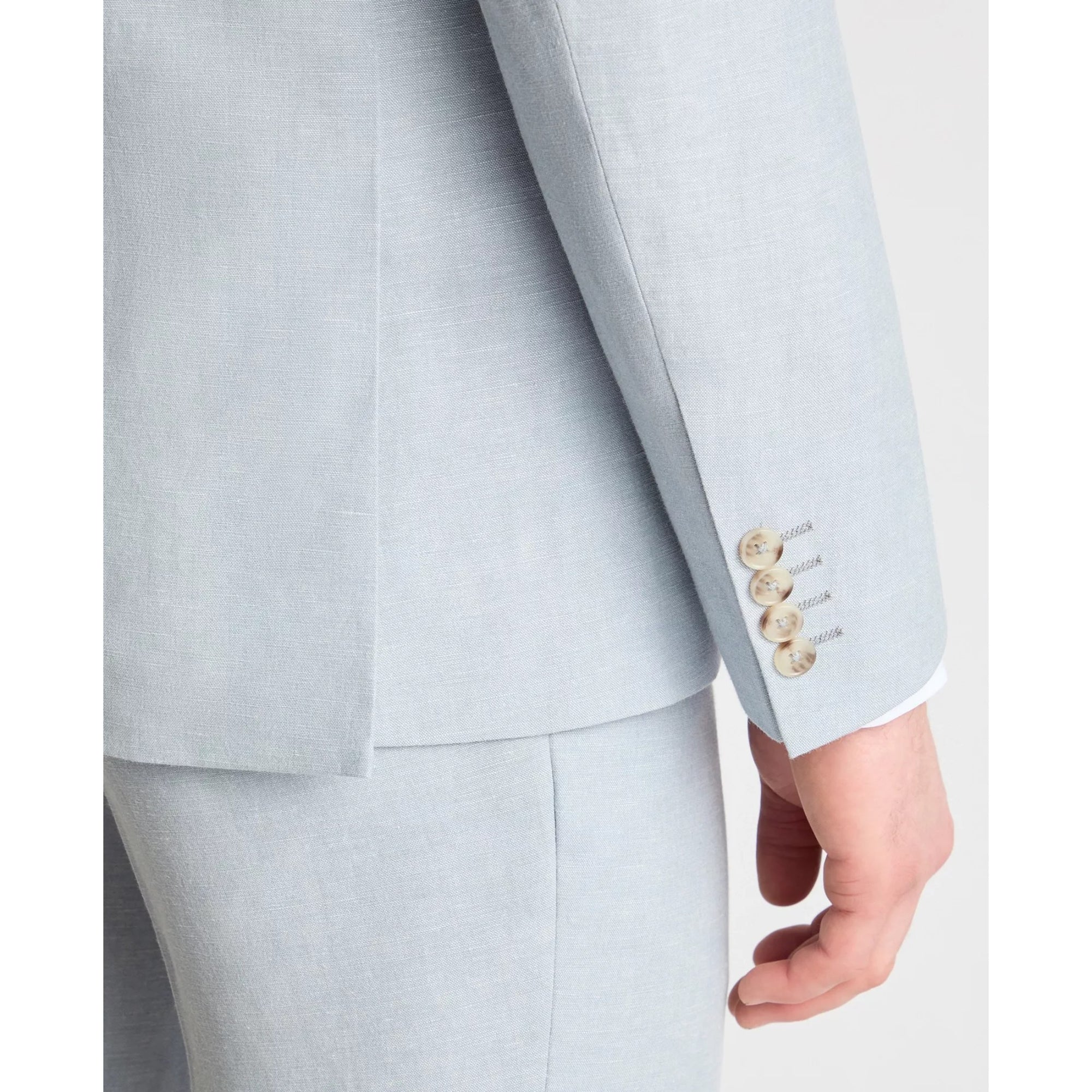 sky blue suit jacket with gold buttons on a white background