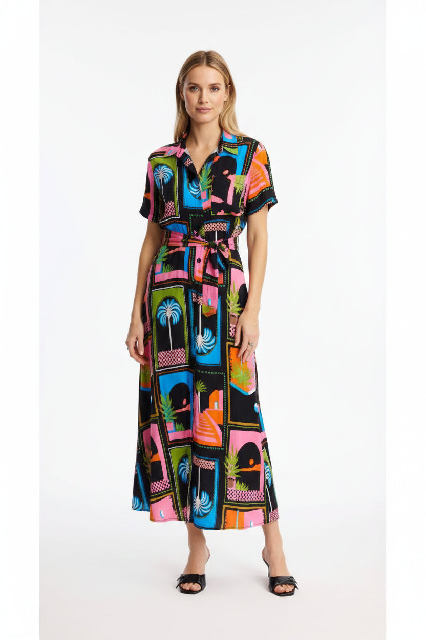 Woman wearing a colorful patterned dress on a white background