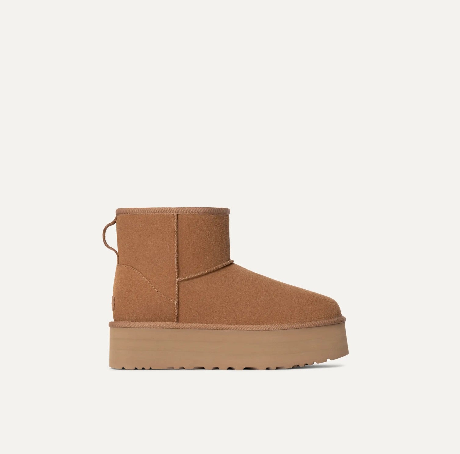 Tan suede platform boot on a white background