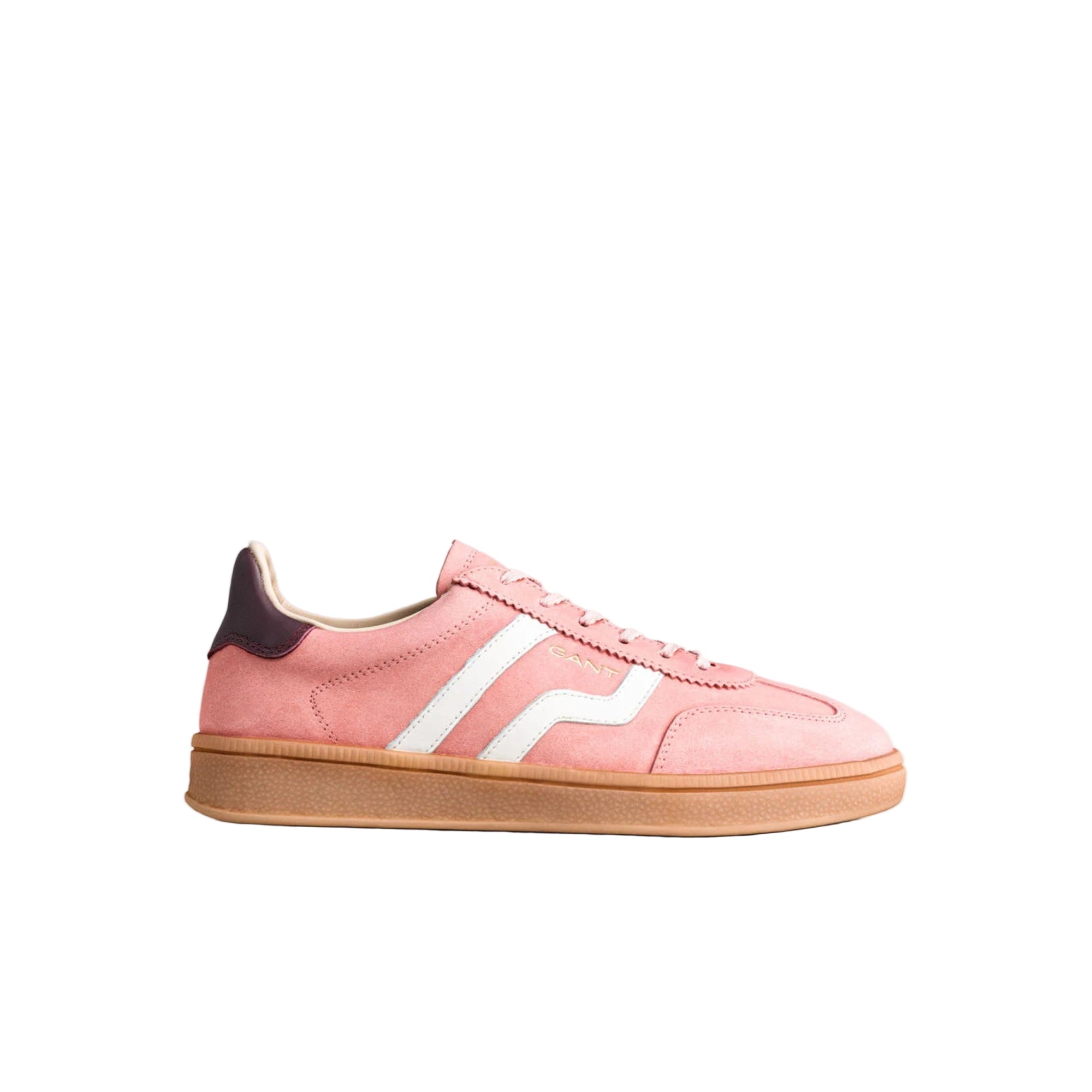 Pink sneaker with white stripes on a gray background