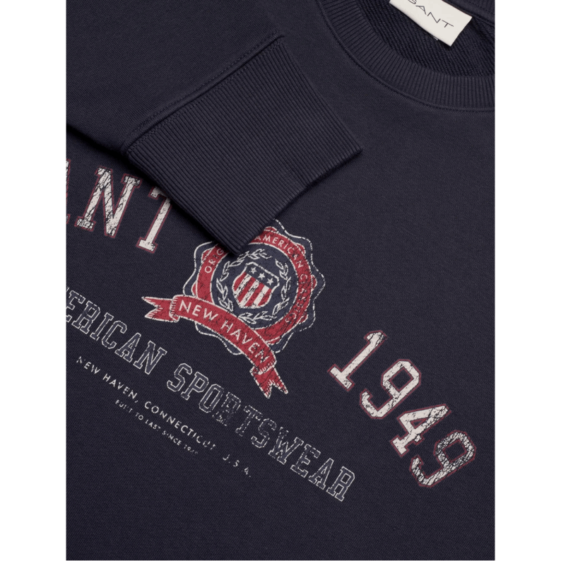Navy blue sweatshirt with Gant logo and text on a white background