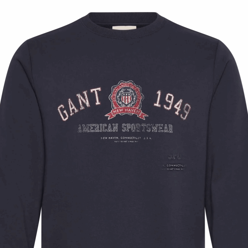 Navy blue sweatshirt with GANT logo and text on a white background