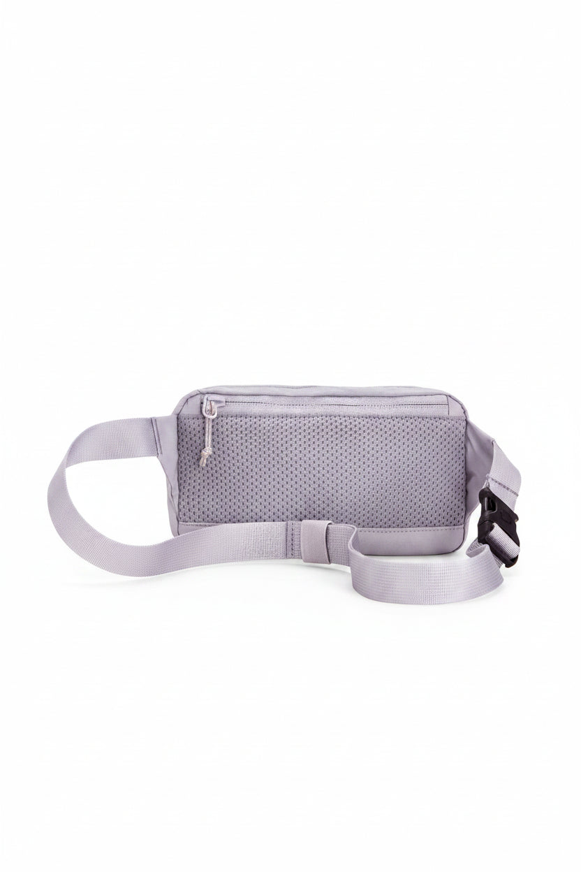 lavender waist bag with a strap on a white background