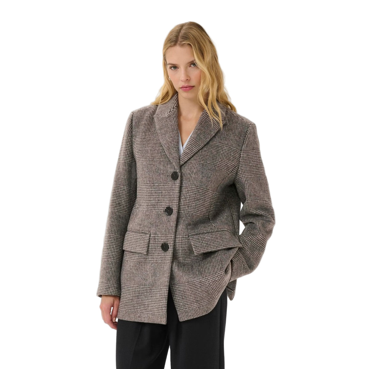 Woman wearing a checkered blazer on a white background