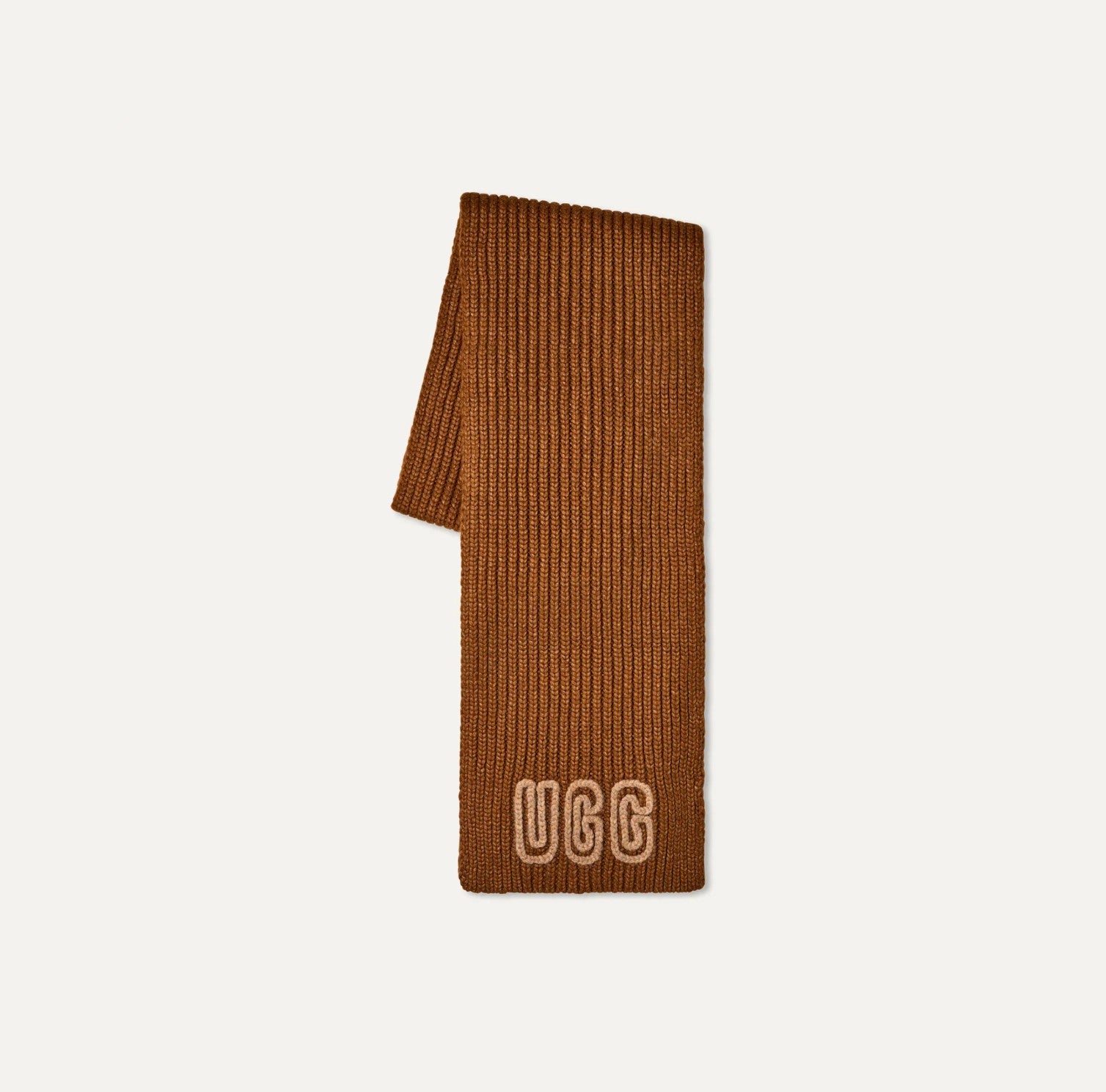 Brown UGG scarf on a light beige background