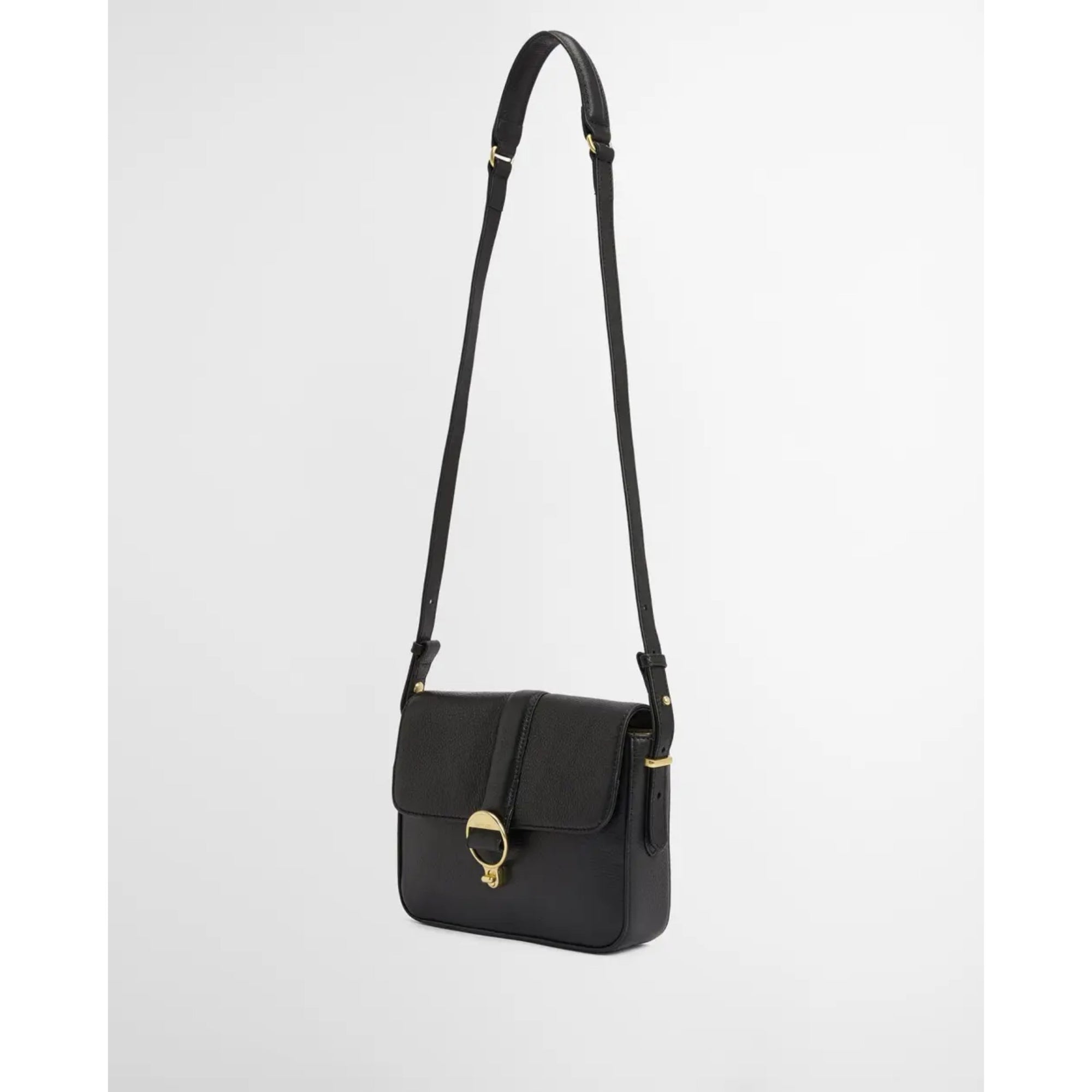 Black shoulder bag with gold clasp on a white background