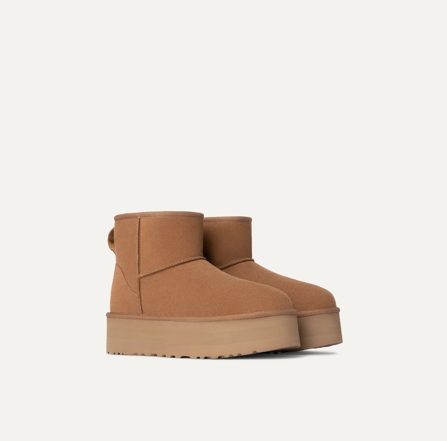 Brown platform ankle boot on a white background