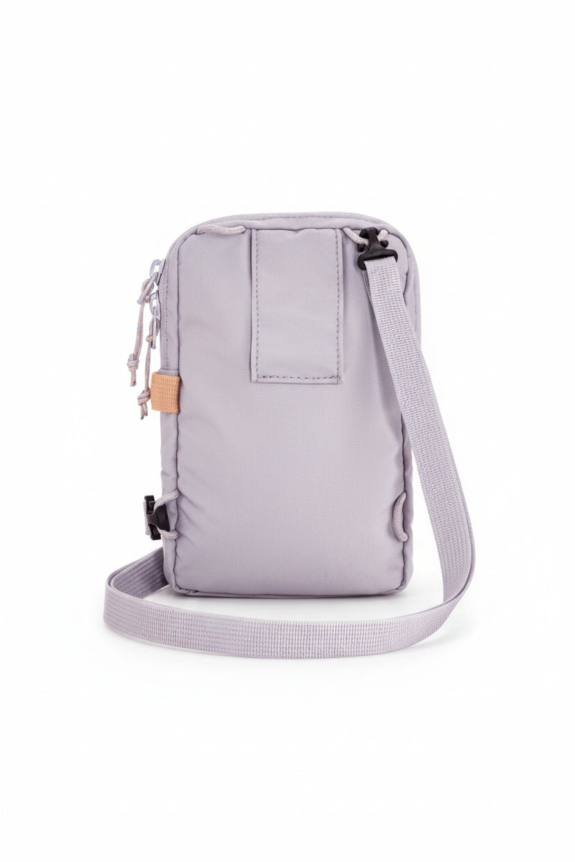 Lavender crossbody bag with a strap on a white background