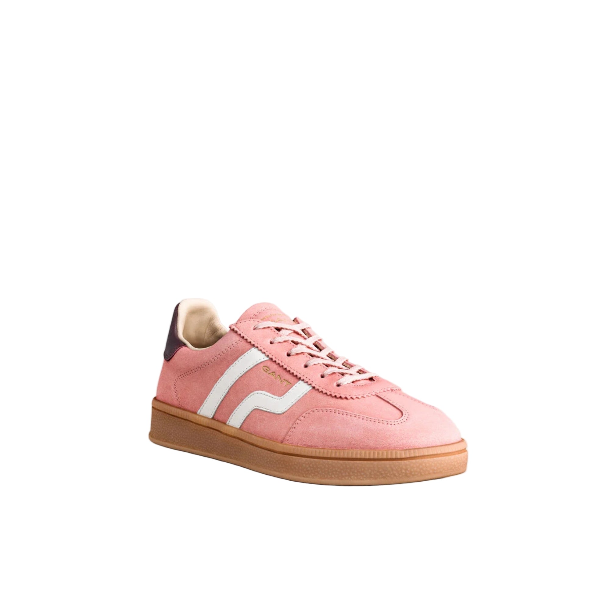 Pink sneaker with white stripes on a light gray background