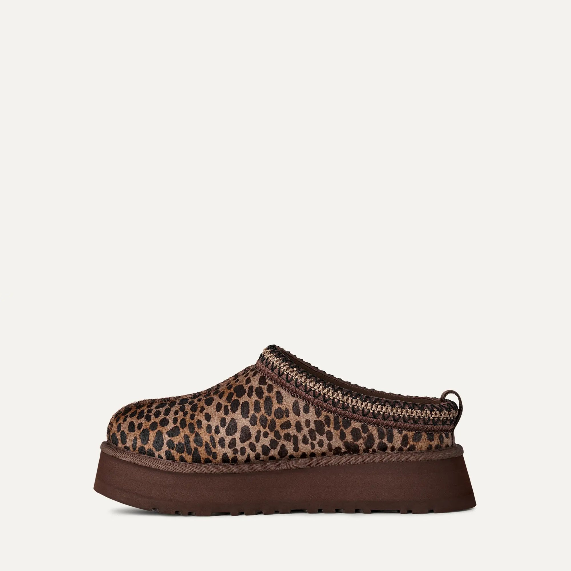 Leopard print slip-on shoe on a white background