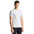 Man wearing a plain white t-shirt against a light gray background