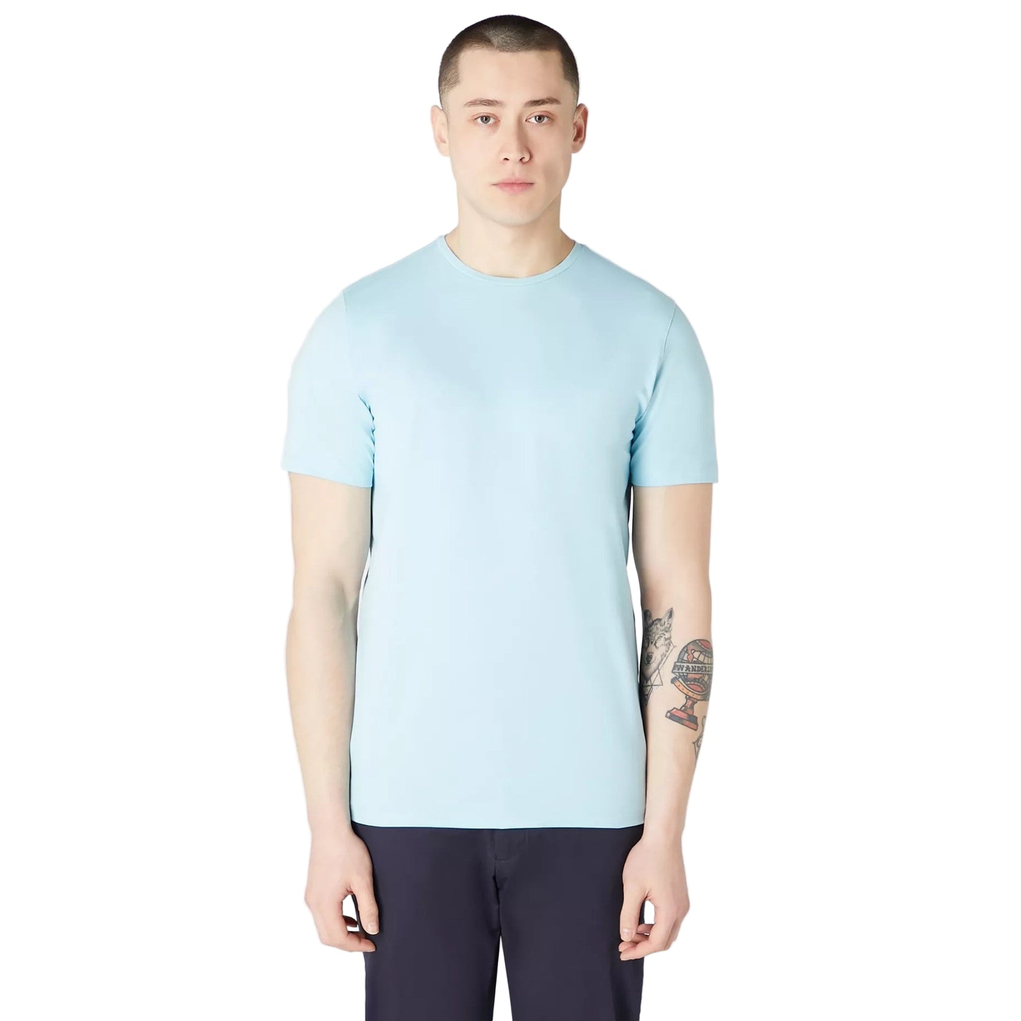 Person wearing a light blue t-shirt and dark pants on a white background