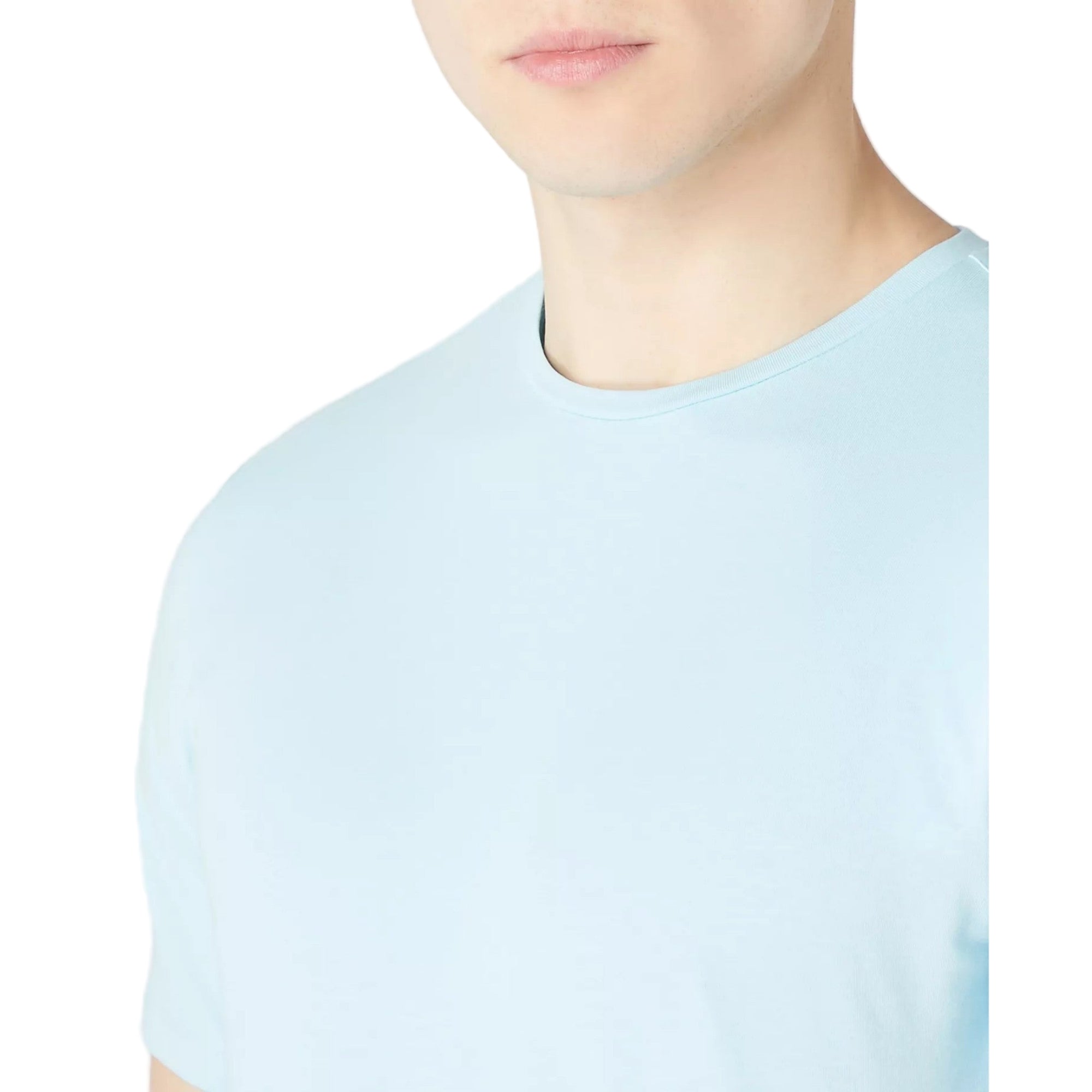Light blue t-shirt worn by a person on a white background