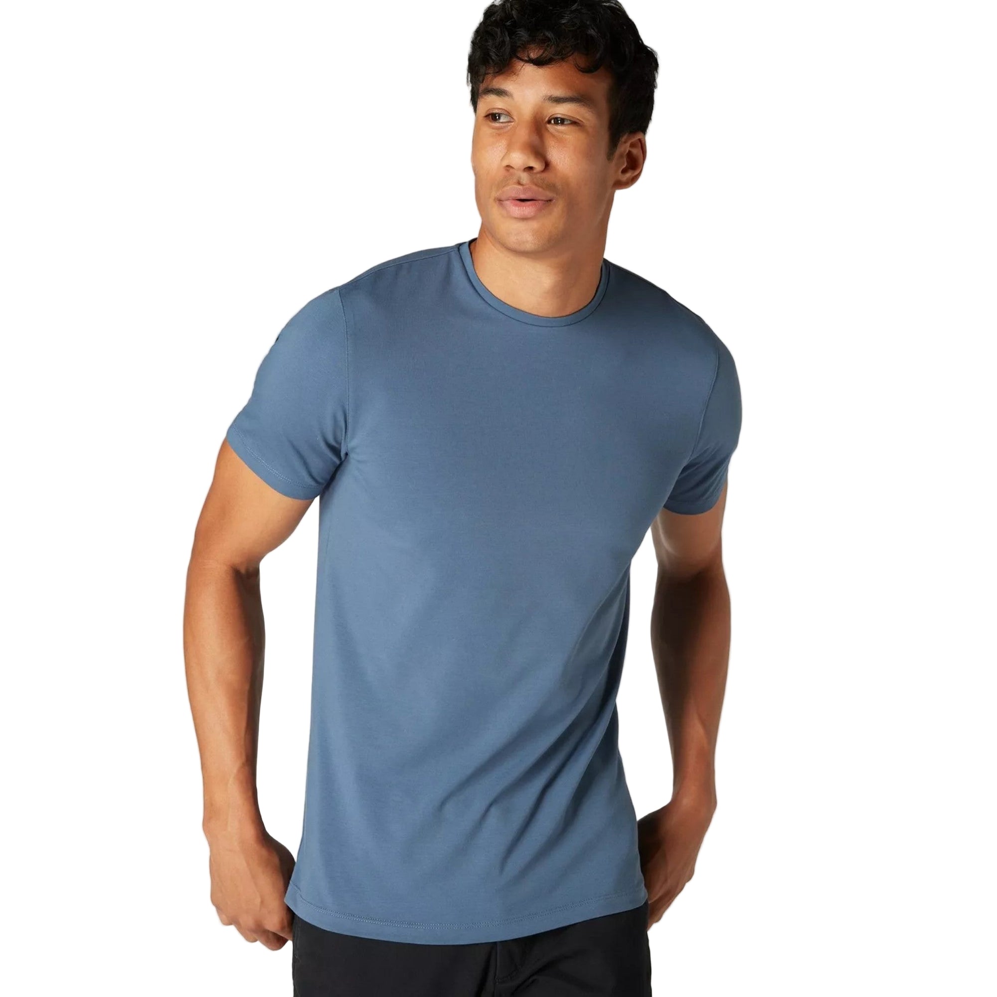 Man wearing a blue t-shirt against a plain background