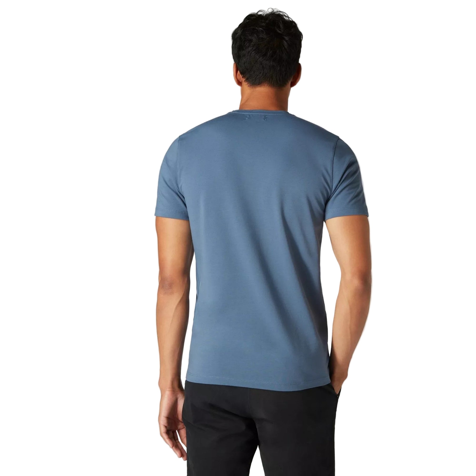 Man wearing a blue t-shirt on a plain background