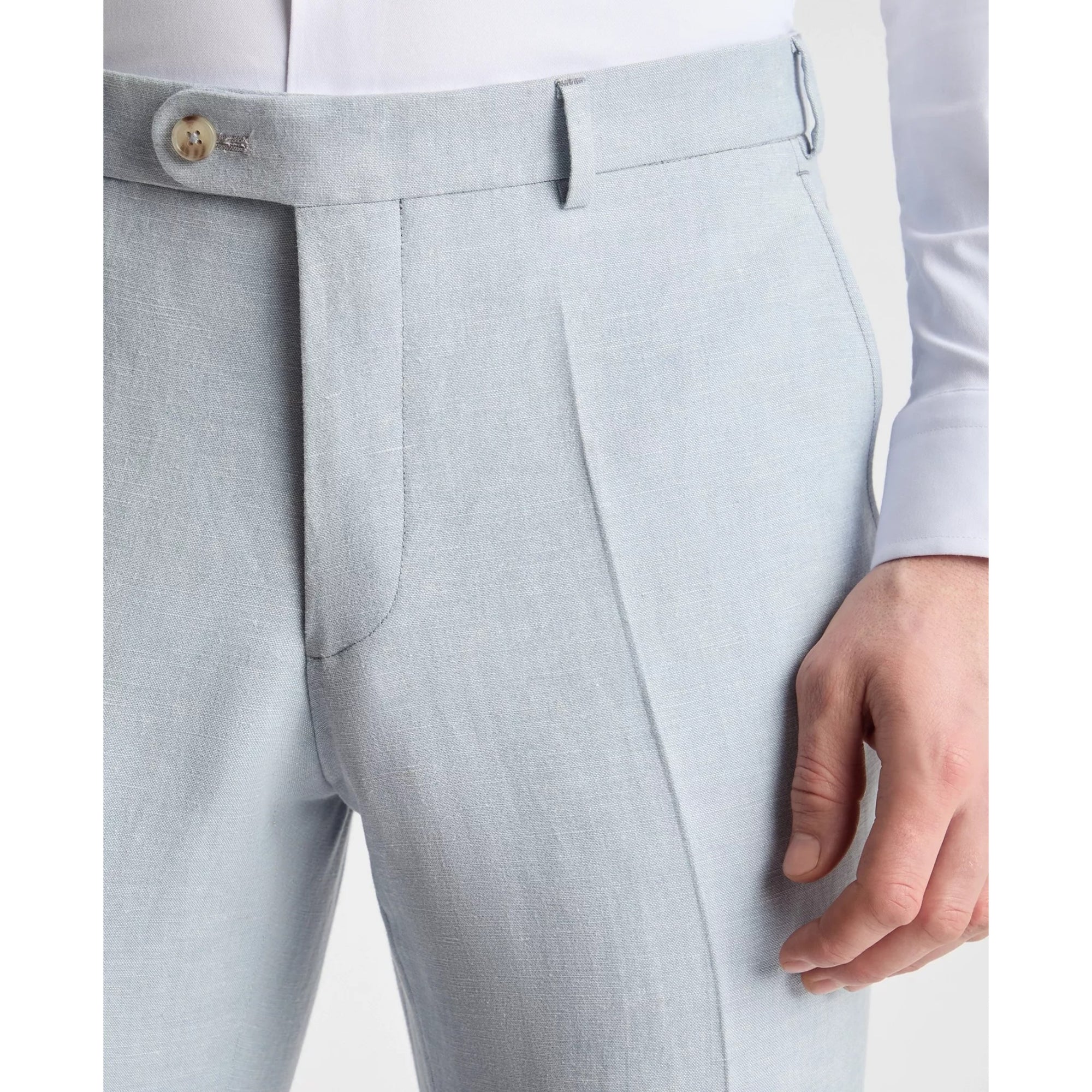 Light blue pants with a button detail on a white background