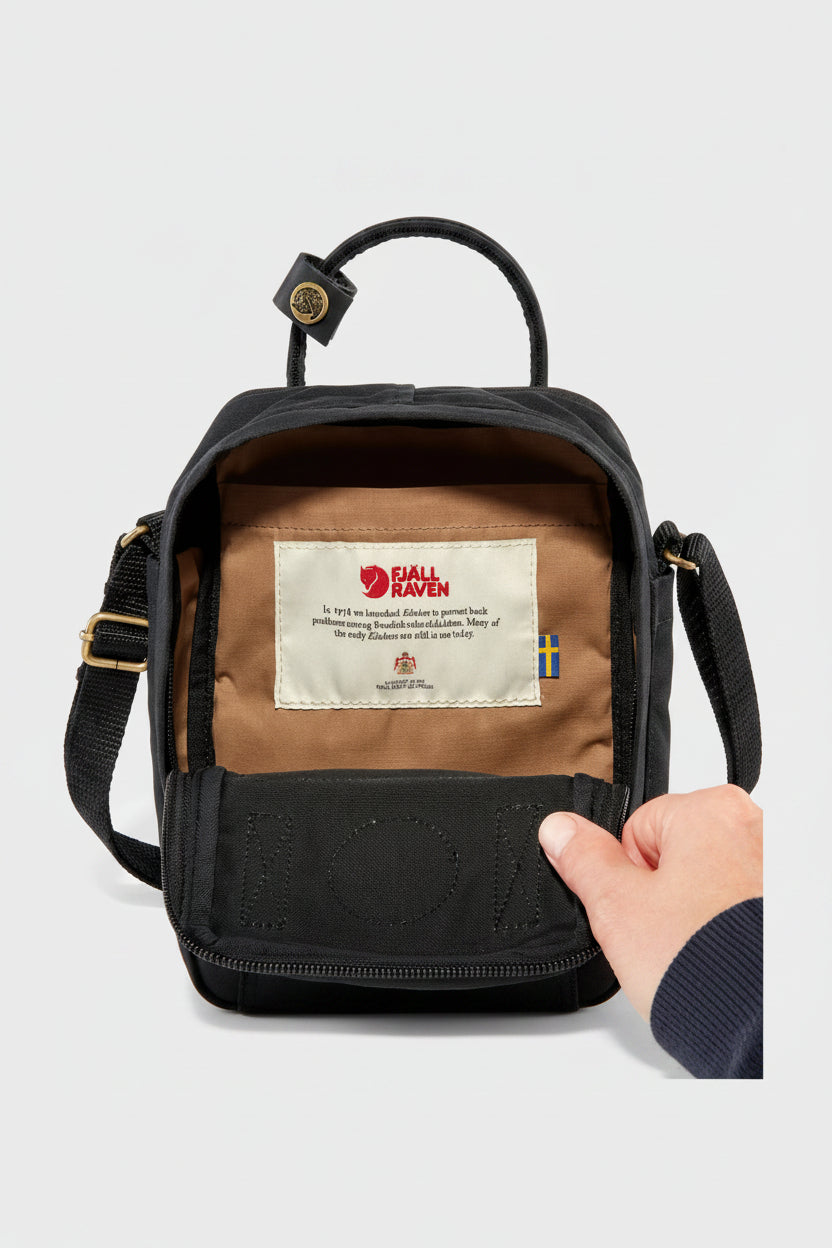 Black backpack with a visible brand label on a light gray background