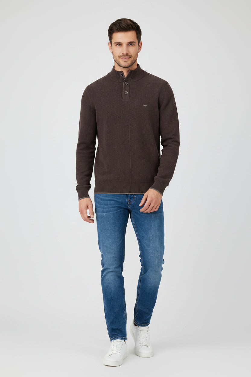 Brown sweater with button details on a white background