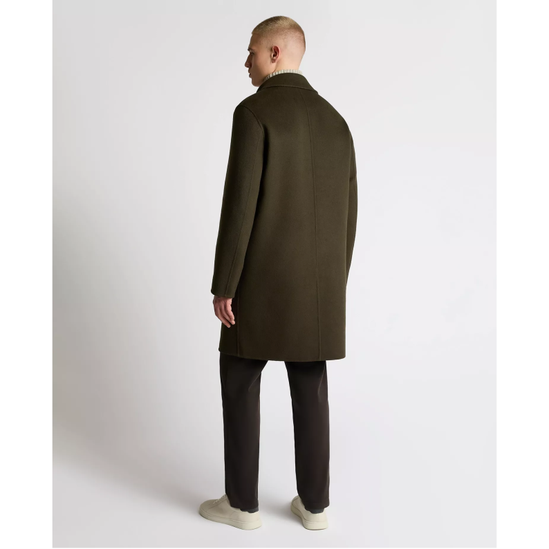 Man wearing a Remus Uomo long dark green coat on a white background