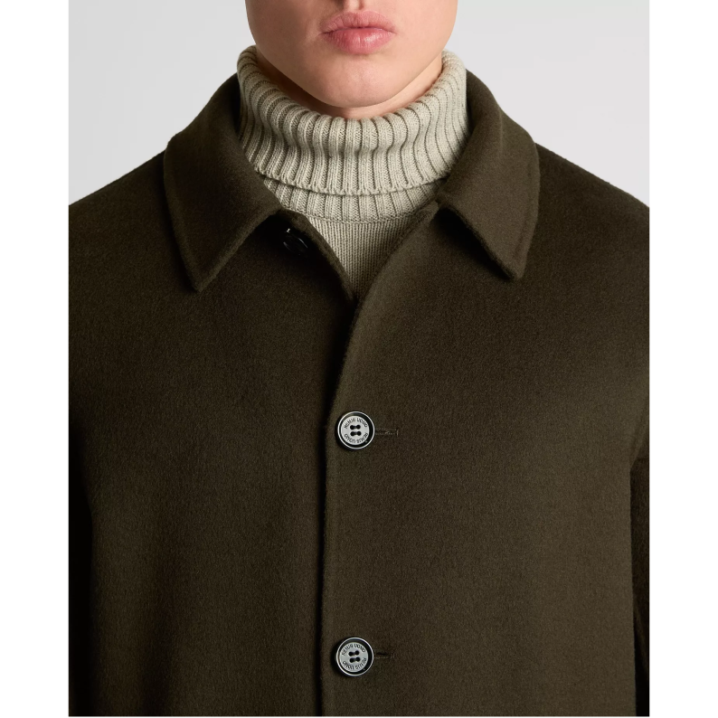 Brown coat with a button detail on a plain background