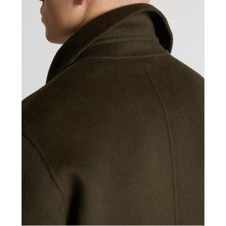 Brown coat worn by a person on a white background