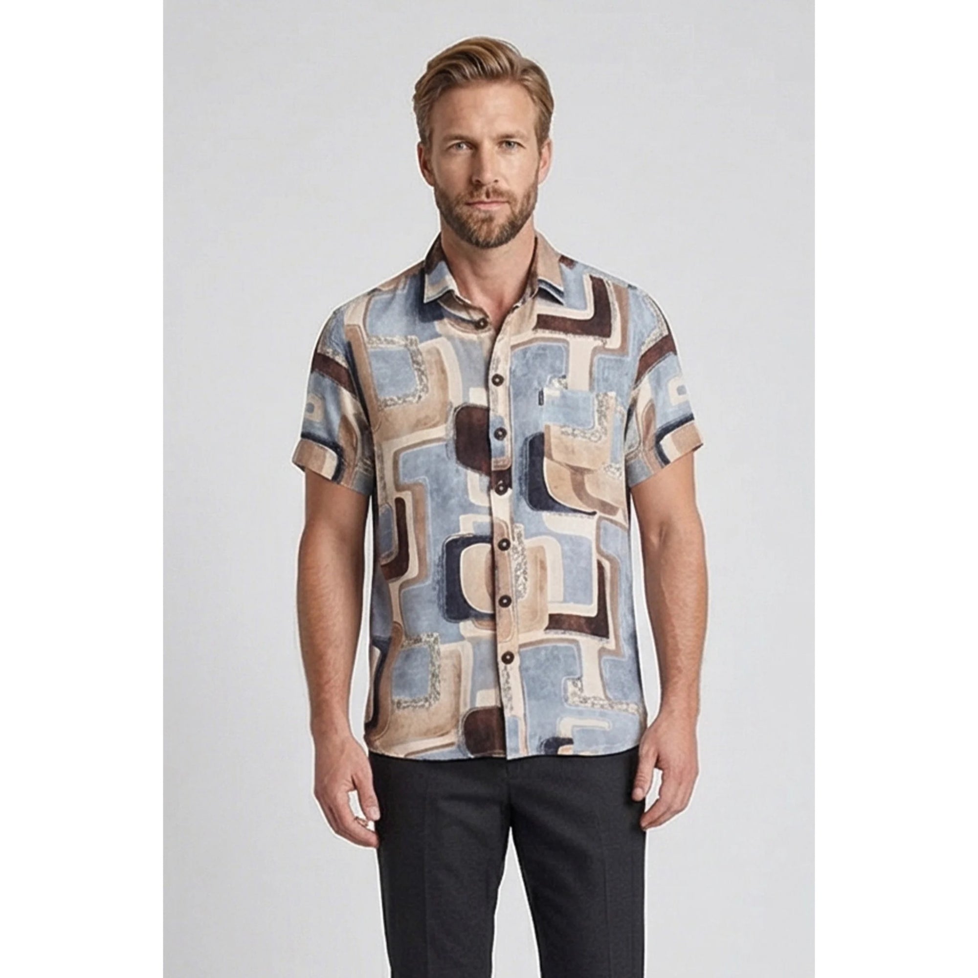 Man wearing a patterned shirt with abstract designs on a plain background