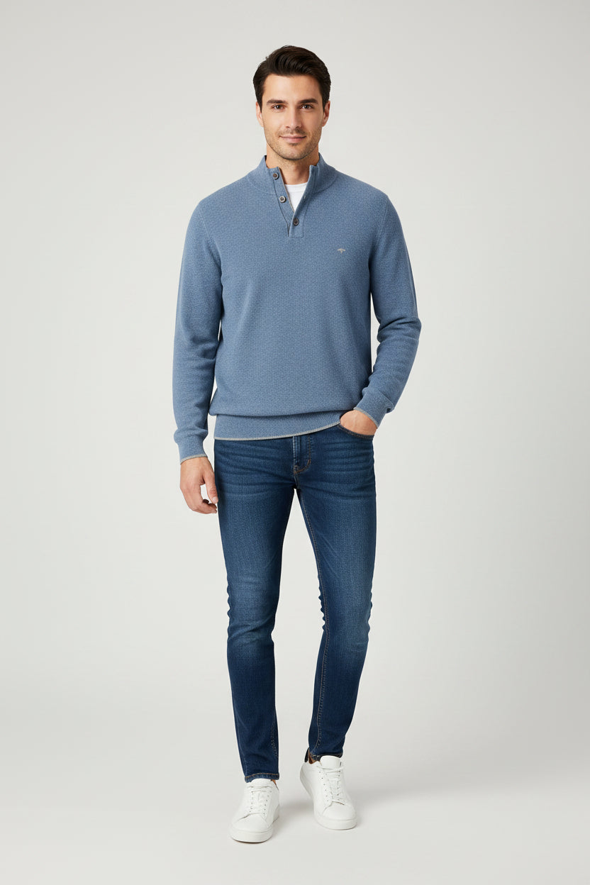 Blue sweater with a brand logo on a white background