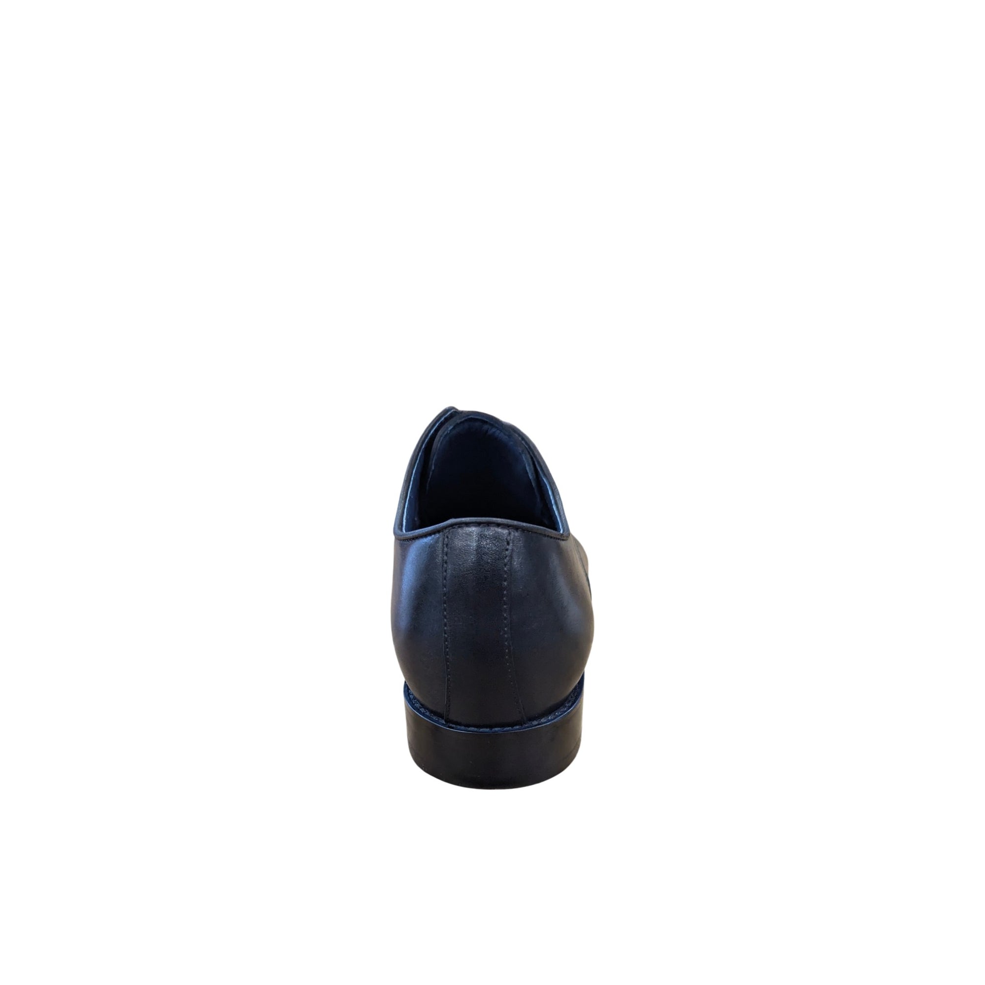 Black slip-on shoe on a white background
