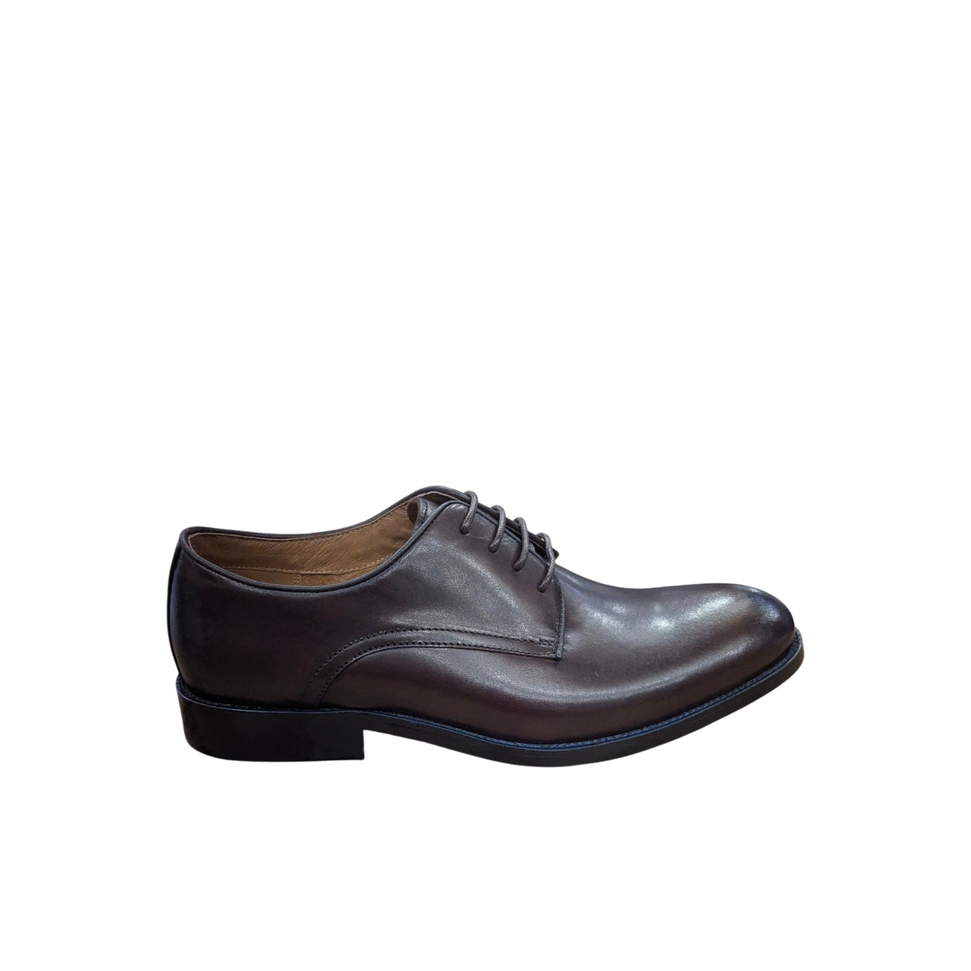 Brown leather dress shoe on a white background