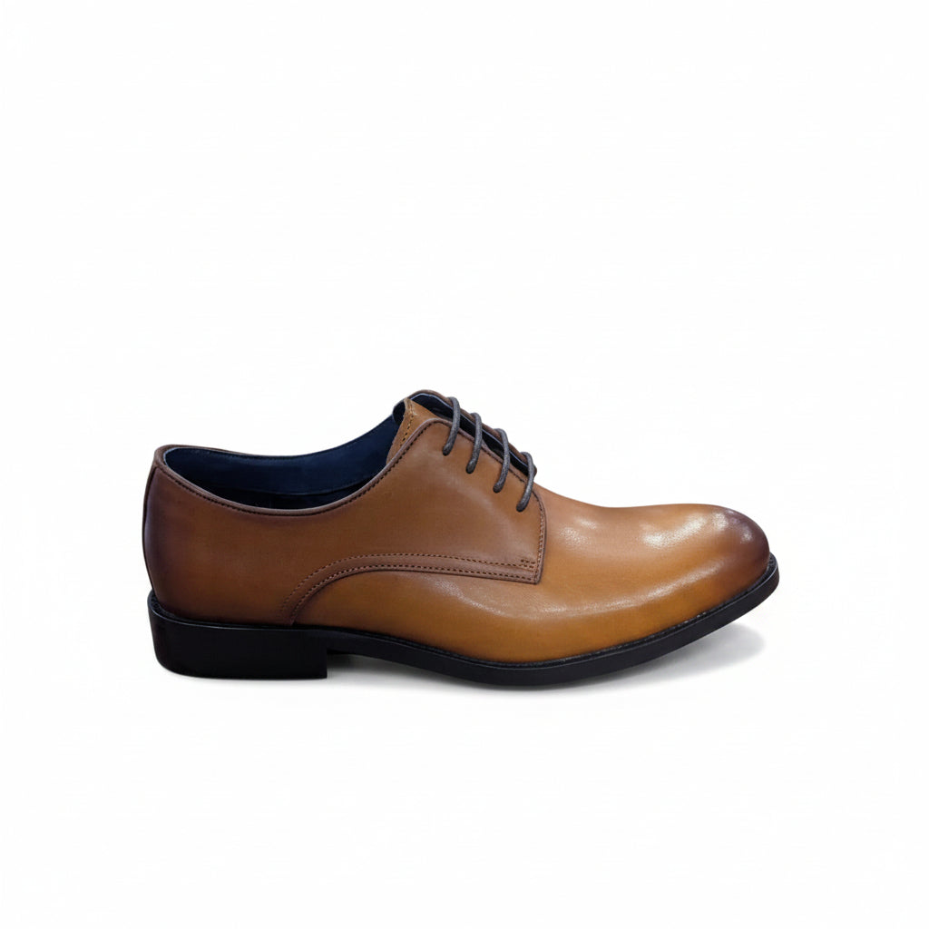 Tan leather dress shoe on a white background