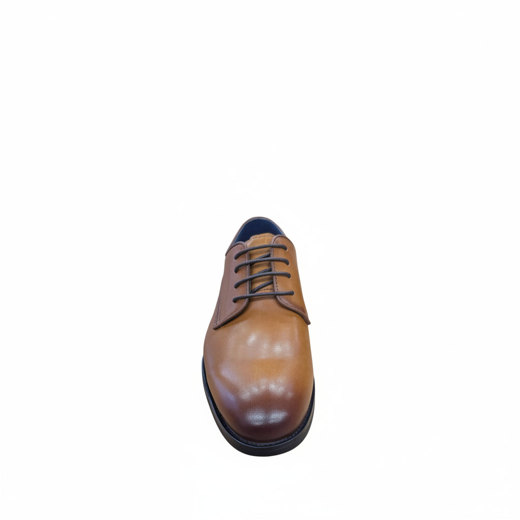 Tan leather dress shoe with black sole on a white background