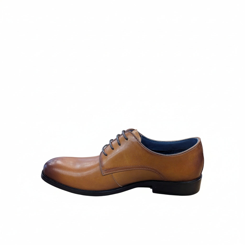 Tan leather shoe on a white background