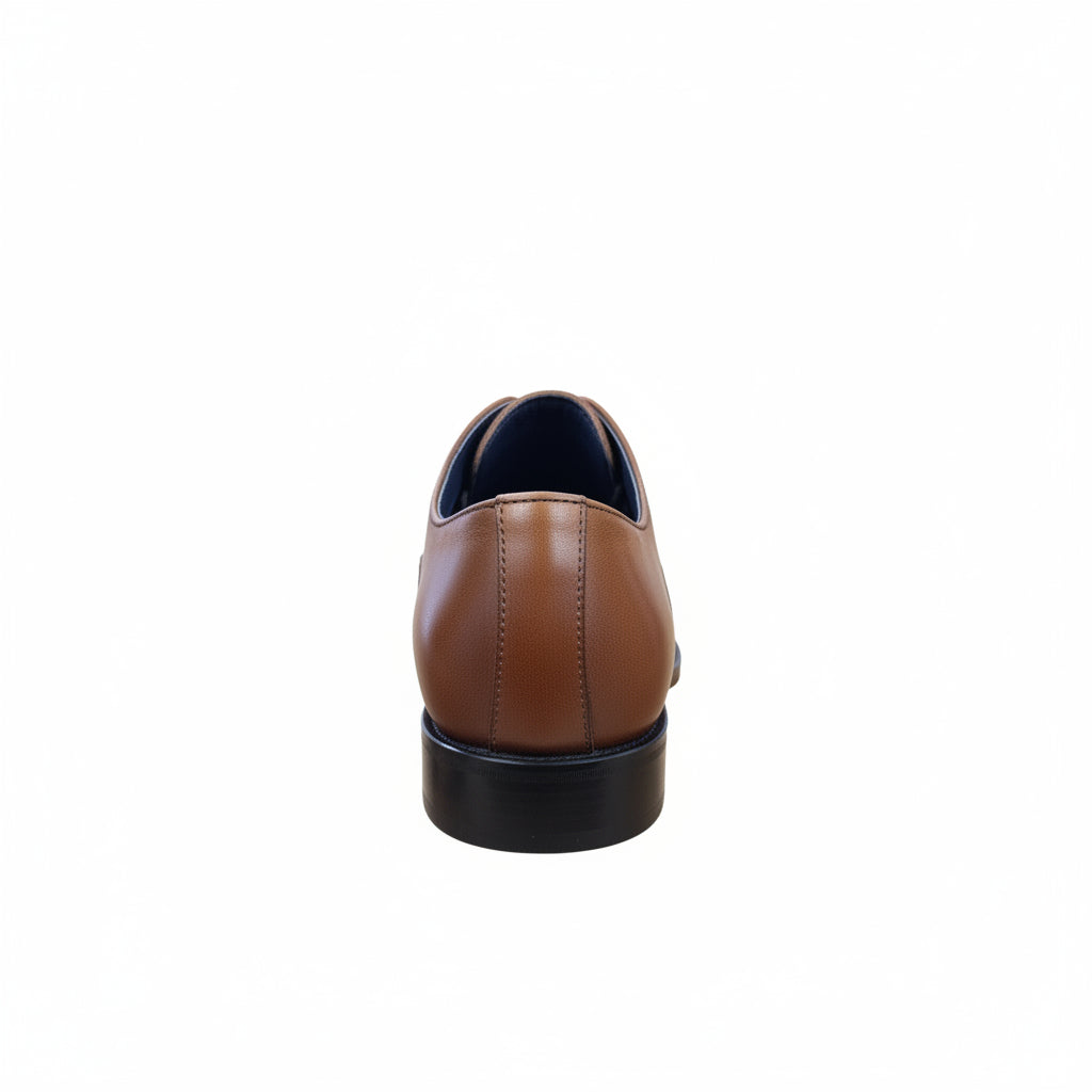 Tan leather shoe on a white background