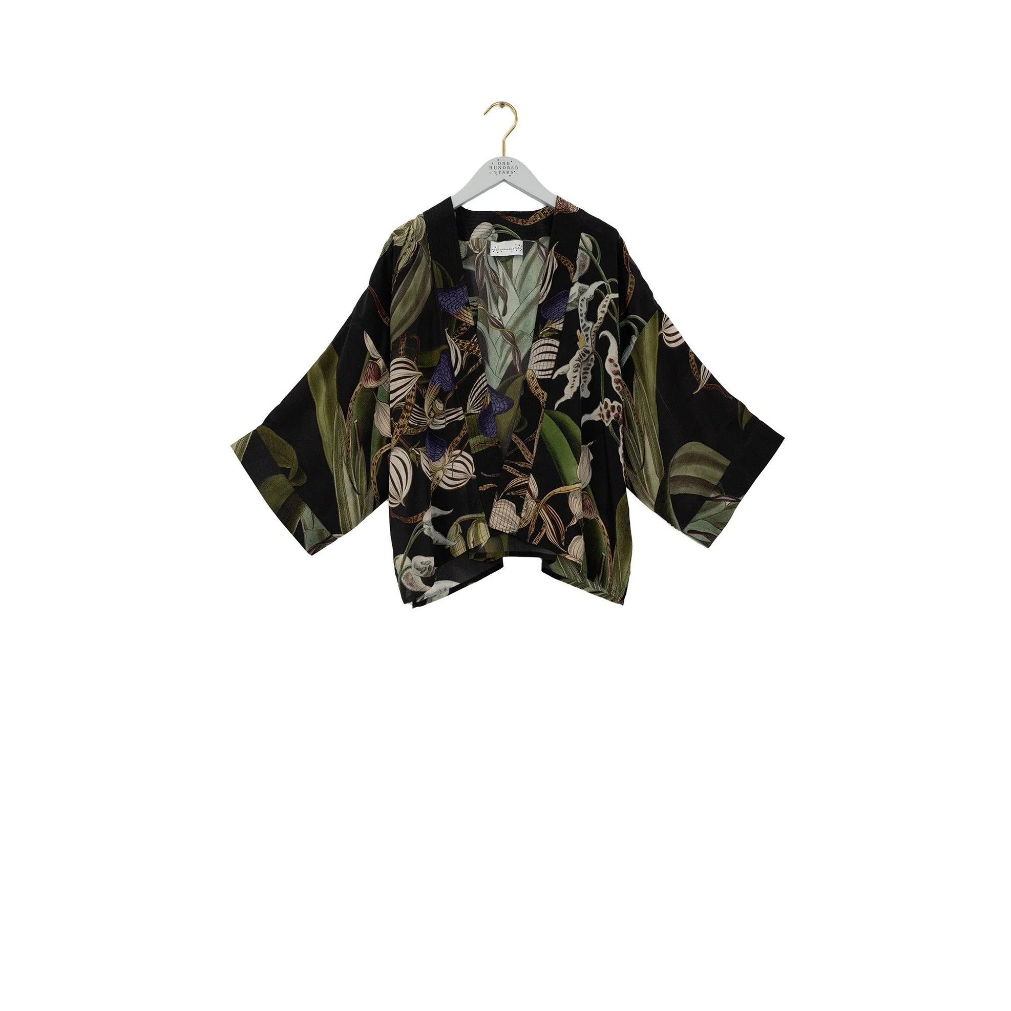 Floral patterned kimono on a hanger against a white background