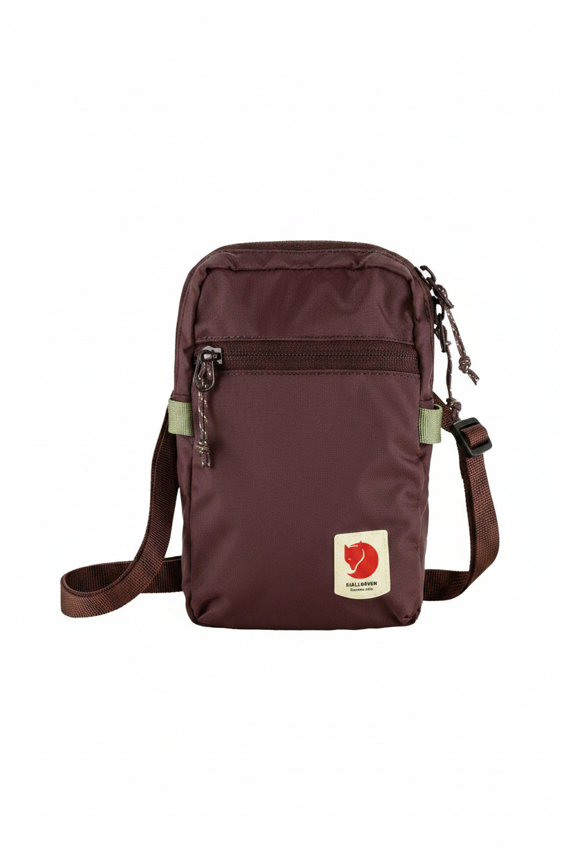 Brown crossbody bag with visible brand logo on a white background