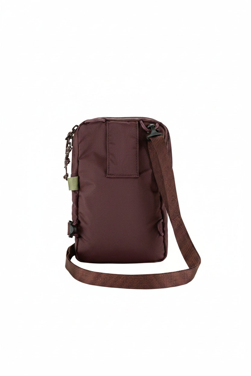 Brown backpack with a strap on a white background