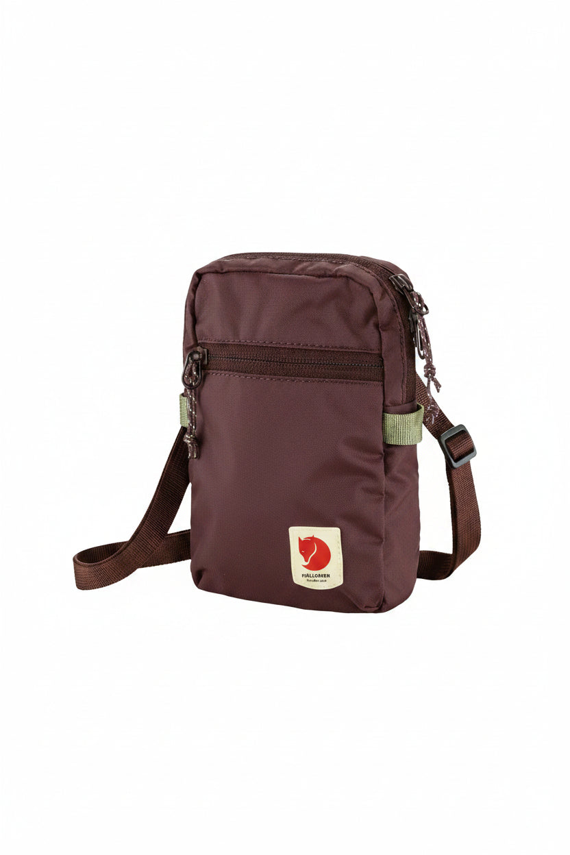 Brown crossbody bag with visible brand logo on a white background