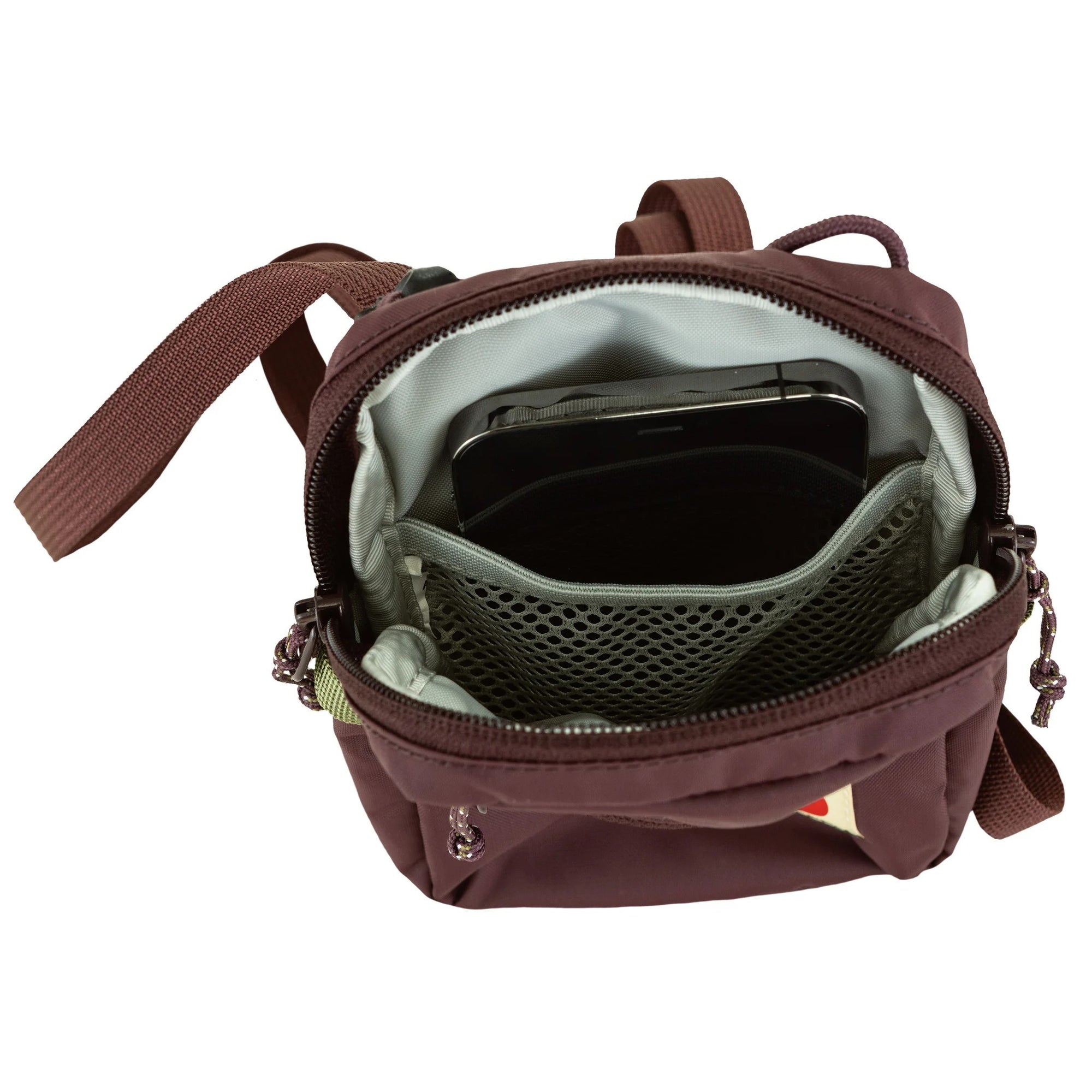 Brown backpack with a phone inside on a white background