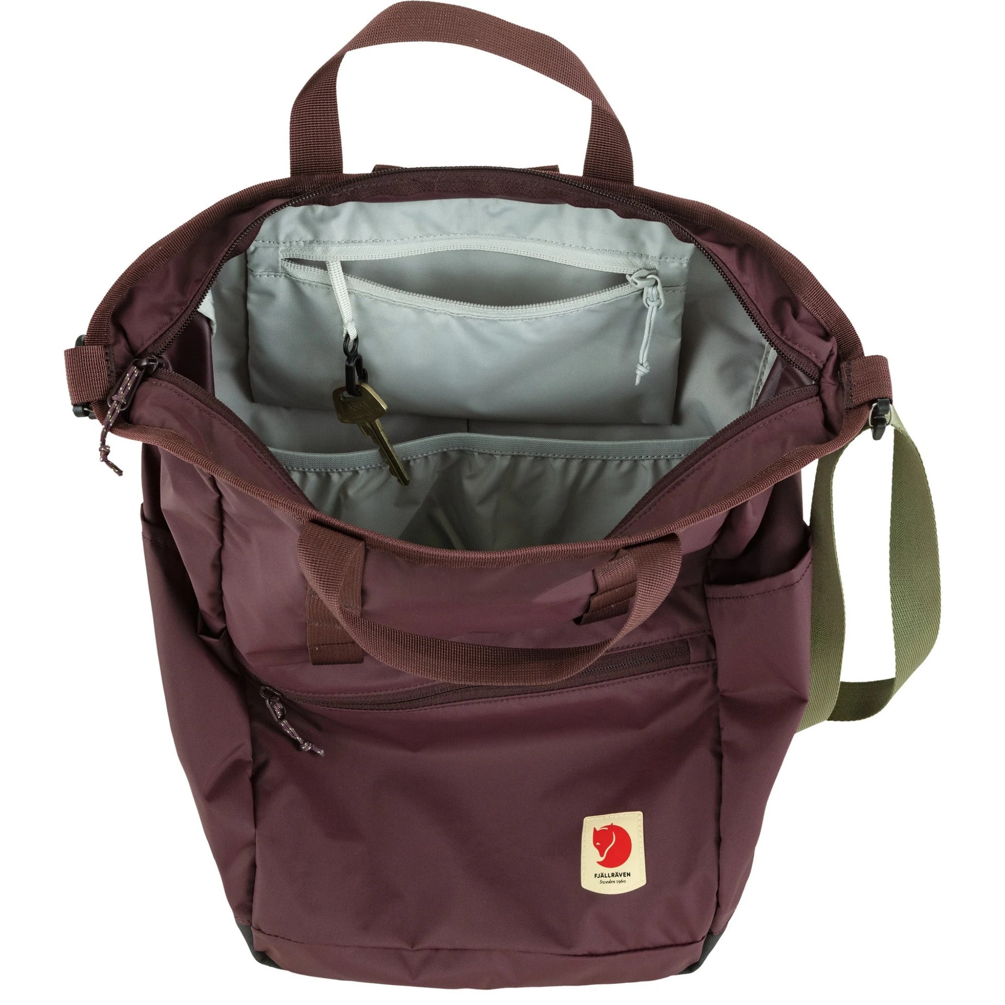 Open maroon backpack with visible interior and Fjällräven logo on a white background