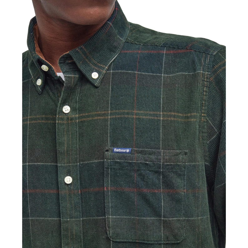 Man wearing a green Barbour plaid shirt close up logo