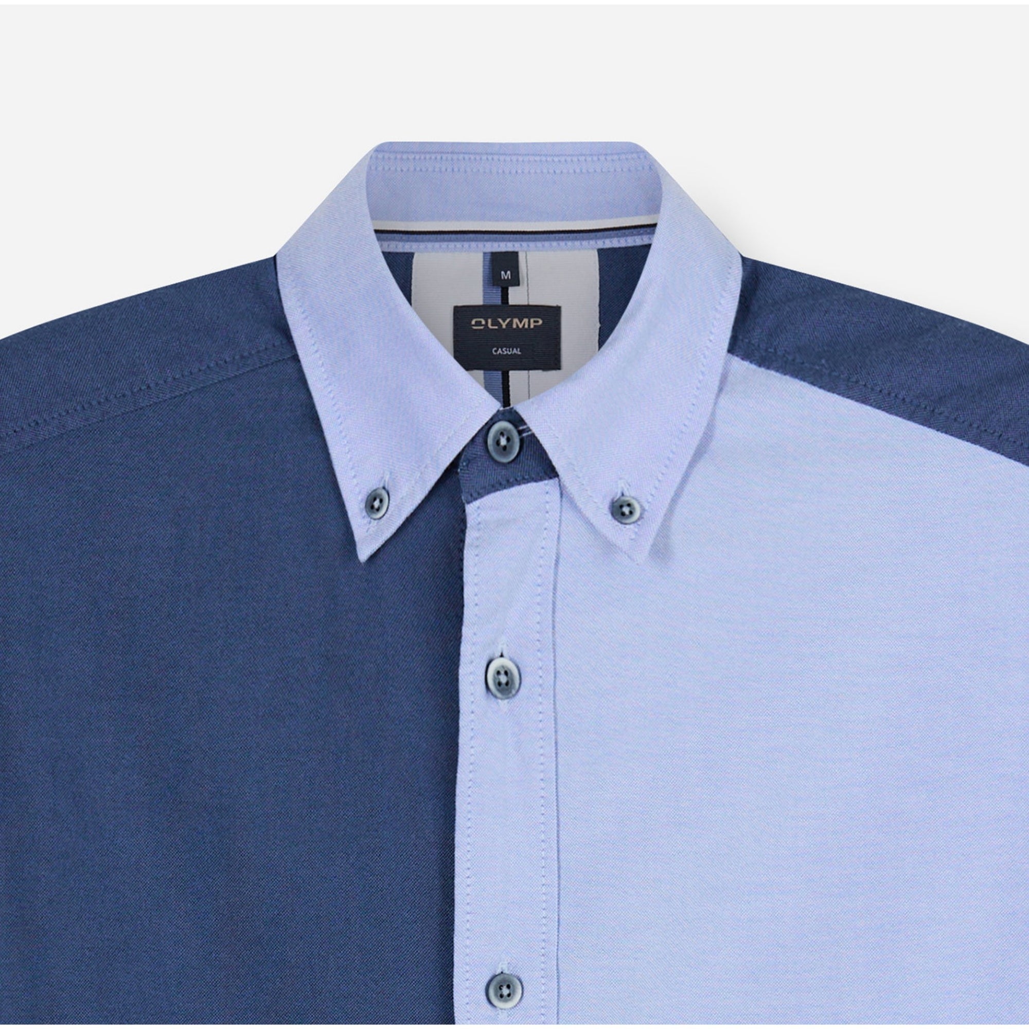 Close-up of a blue and light blue shirt with collar and buttons, featuring Olymp branding.