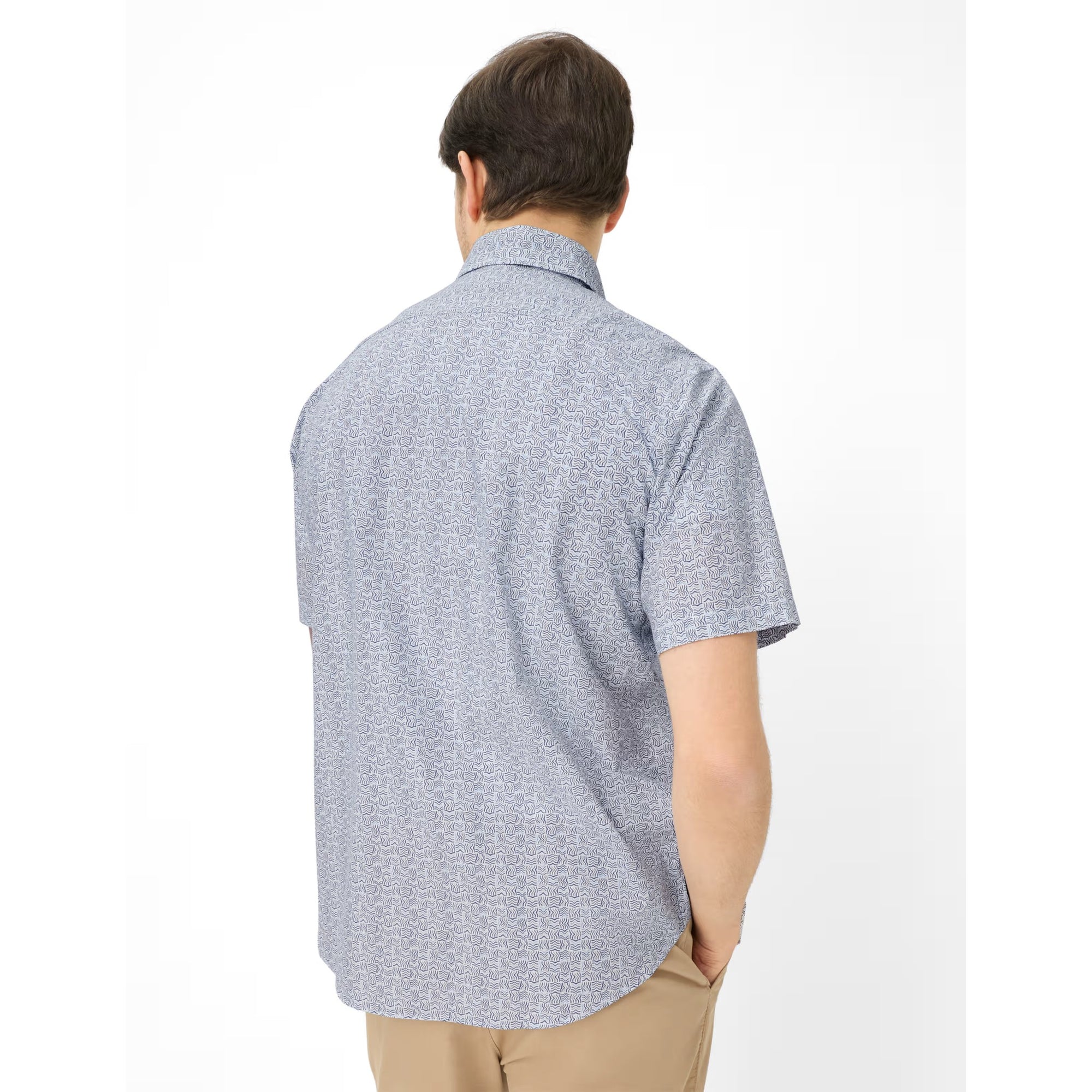 Man wearing a short-sleeve button-up shirt on a white background