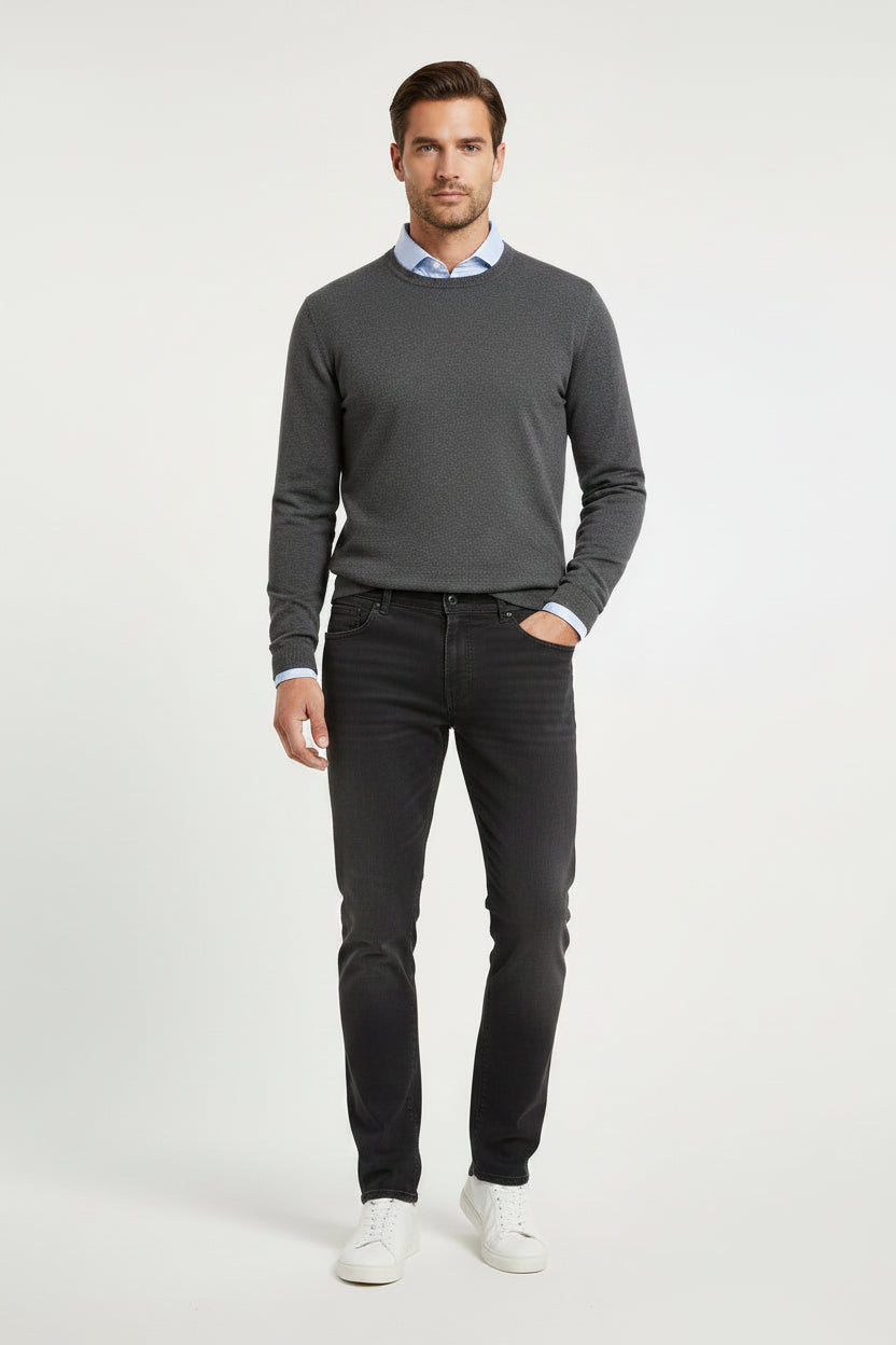 A pair of slim-fit dark grey cotton jeans shown flat against a light gray background.