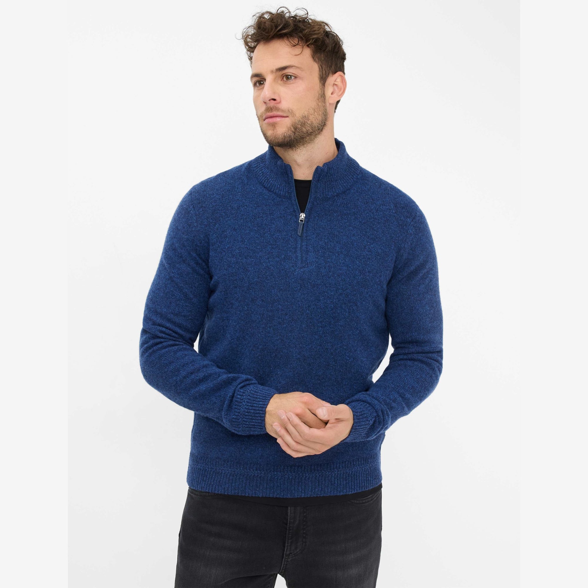 Man wearing a blue Brax quarter zip sweater