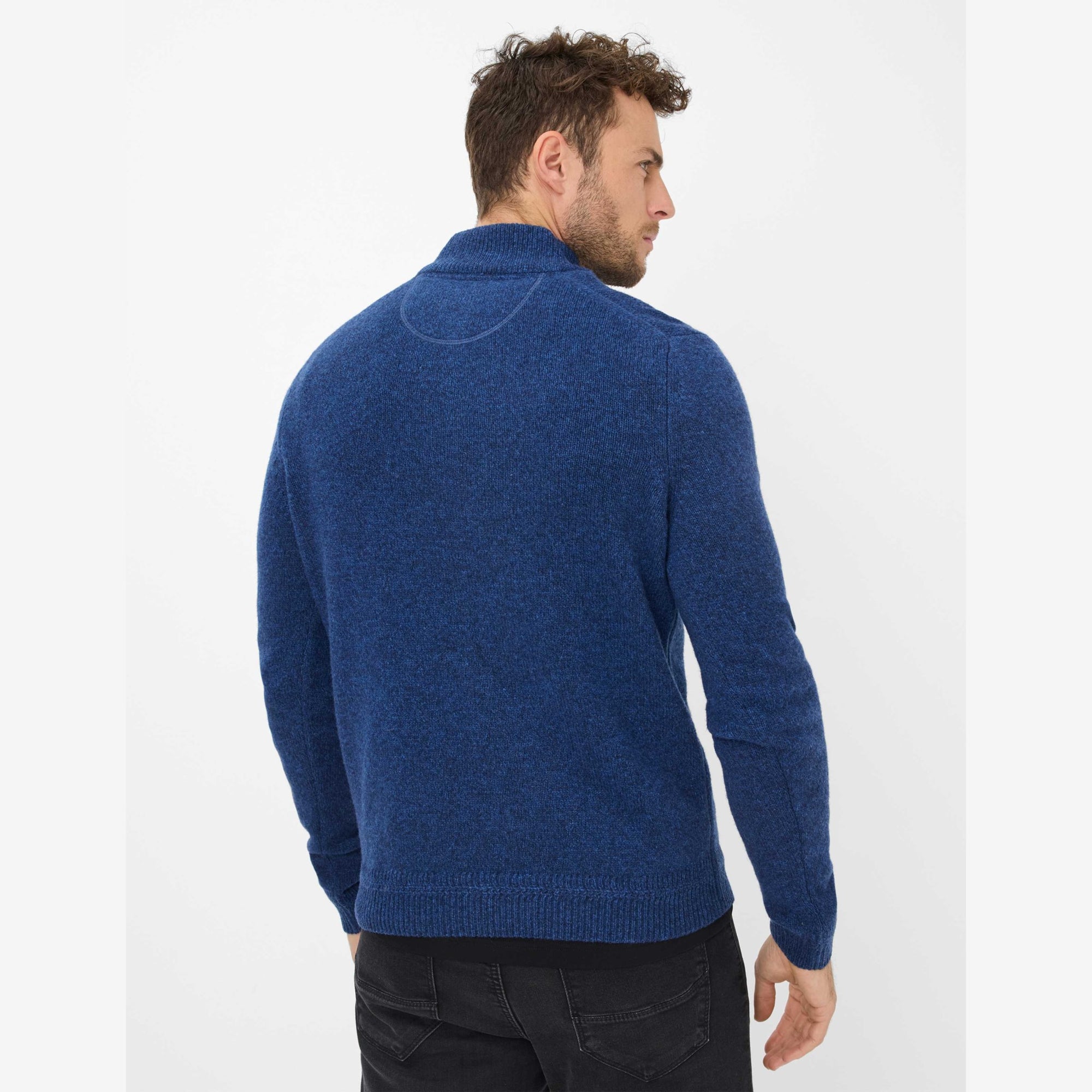 Man wearing a blue Brax quarter zip sweater reverse