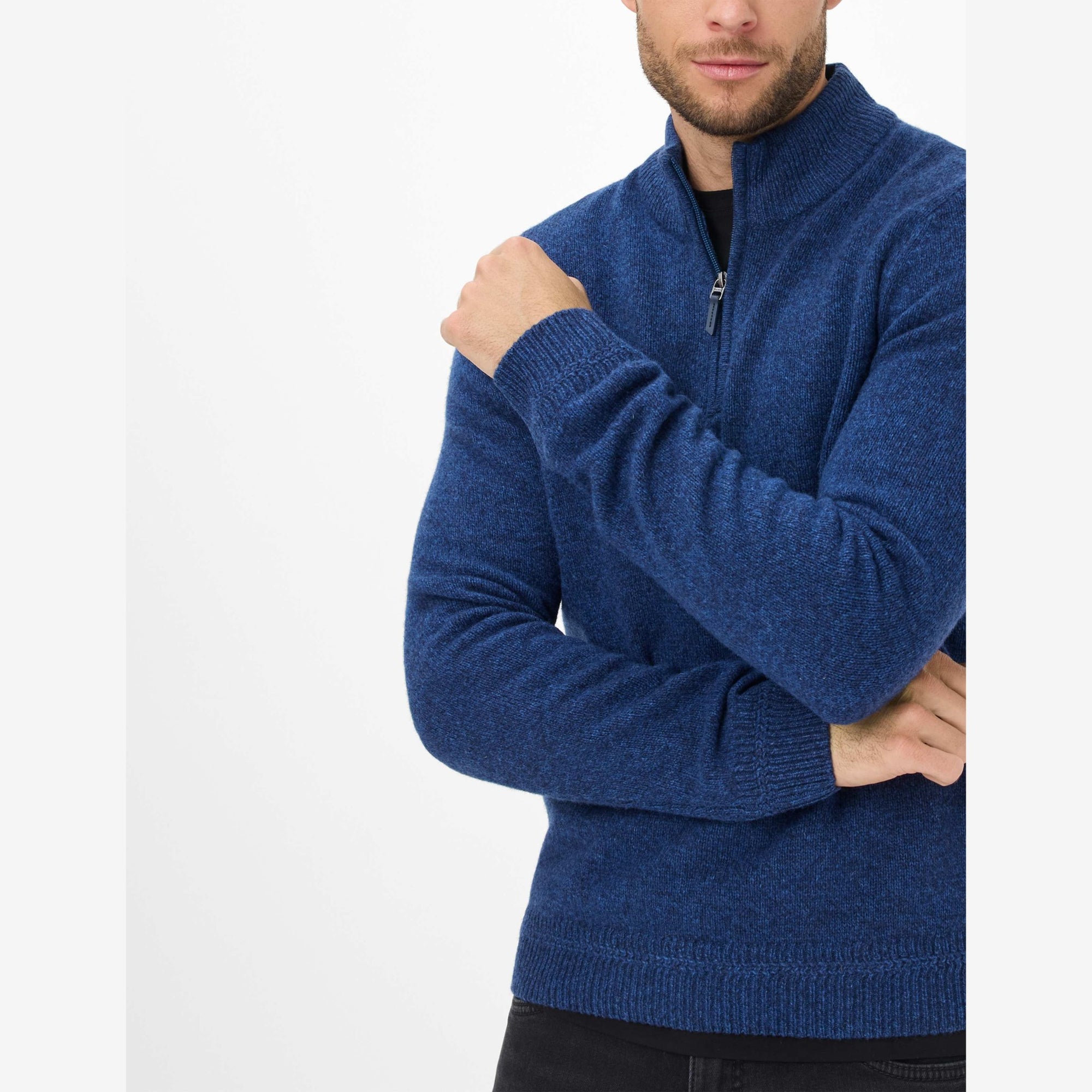 Man wearing a blue Brax quarter zip sweater