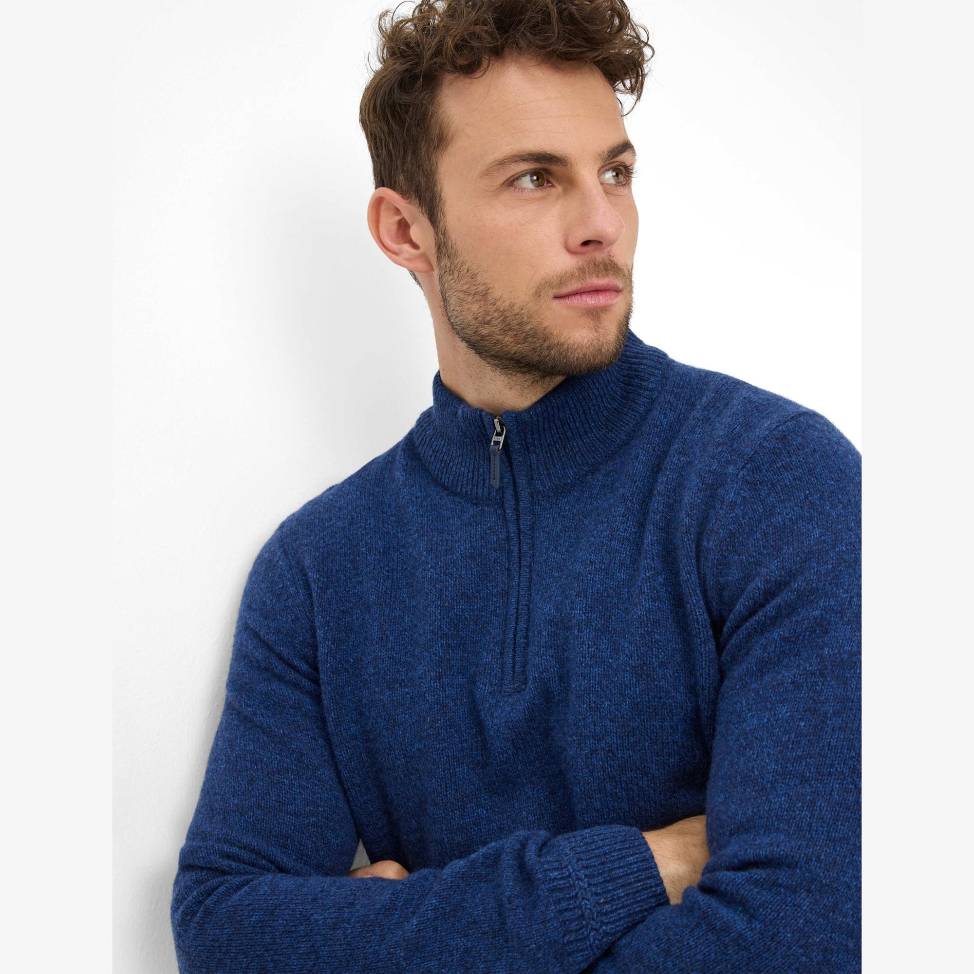 Man wearing a blue Brax quarter zip sweater